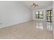 Spacious living room with tile flooring and large windows at 7654 Sugar Bend Dr # 7654, Orlando, FL 32819
