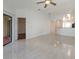 Living room with tile floors and view into kitchen area at 7654 Sugar Bend Dr # 7654, Orlando, FL 32819
