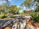 Relaxing patio area with tables, chairs, and umbrellas at 7654 Sugar Bend Dr # 7654, Orlando, FL 32819