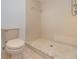Clean shower with beige tile surround at 7654 Sugar Bend Dr # 7654, Orlando, FL 32819