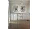 Close up of dining area features wood-look flooring and built-in cabinetry at 103 Bougainvillea Dr, Leesburg, FL 34748