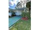 Charming single-story home with well-manicured lawn and colorful landscaping at 103 Bougainvillea Dr, Leesburg, FL 34748