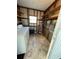 Laundry room with washer, dryer, shelving, and ample storage space at 103 Bougainvillea Dr, Leesburg, FL 34748