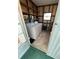 Laundry room with washer, dryer, shelving, and ample storage space at 103 Bougainvillea Dr, Leesburg, FL 34748