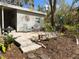 Charming brick patio area, perfect for outdoor relaxation and entertaining at 106 Royal Palm Dr, Leesburg, FL 34748