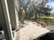 Relaxing outdoor patio features comfortable seating and a serene backyard view at 106 Royal Palm Dr, Leesburg, FL 34748