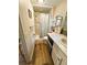 Bathroom features a standing shower, modern vanity, and toilet at 106 Royal Palm Dr, Leesburg, FL 34748