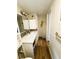 Bathroom features a long vanity with decorative mirror, and a walk-in shower at 106 Royal Palm Dr, Leesburg, FL 34748