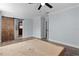 Bedroom boasting a barn door and neutral walls, offering a blank canvas for creating your dream space at 1107 Linmar Ave, Fruitland Park, FL 34731