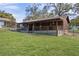 Charming single-story home with a spacious yard and a covered front porch at 1107 Linmar Ave, Fruitland Park, FL 34731
