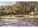 View of a metal carport and outbuildings on the property, useful for storage at 1107 Linmar Ave, Fruitland Park, FL 34731