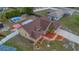 Aerial view of the home; has a pool in the backyard, along with a beautifully landscaped front yard at 1134 Norwood Dr, Deltona, FL 32725