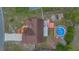 Overhead view of home with a pristine pool and lush landscaping in a beautiful backyard at 1134 Norwood Dr, Deltona, FL 32725