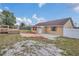 Backyard with a patio, deck, shed, and room for recreation at 1134 Norwood Dr, Deltona, FL 32725