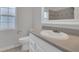 A full bath with gray counters, white cabinets and a modern sink basin at 1134 Norwood Dr, Deltona, FL 32725