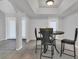Dining room featuring a round table with seating for four, tile flooring, and ample lighting at 1134 Norwood Dr, Deltona, FL 32725