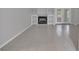 Open living room featuring tile flooring, a fireplace, and built-in shelving at 1134 Norwood Dr, Deltona, FL 32725