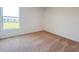 Bedroom with neutral carpet, white walls, and a window providing natural light at 1212 Caloosa Ridge Ave, Babson Park, FL 33827