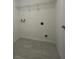 Empty laundry room with tile flooring and utility connections at 1212 Caloosa Ridge Ave, Babson Park, FL 33827