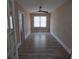 A spacious bedroom features wood floors, a ceiling fan, and natural light from the window at 134 Daytona Ave, Daytona Beach, FL 32117
