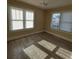 Bright bedroom with wood floors, a ceiling fan, and two windows to let in natural light at 134 Daytona Ave, Daytona Beach, FL 32117
