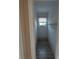 A walk-in closet offers ample storage with a clothing rack, white walls, and a window at 134 Daytona Ave, Daytona Beach, FL 32117