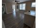 Dining area with a ceiling fan, built-in corner cabinet, and wood-look flooring at 134 Daytona Ave, Daytona Beach, FL 32117