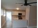 Kitchen featuring white cabinets, stainless steel appliances, countertops, and central island, creating a modern space at 134 Daytona Ave, Daytona Beach, FL 32117