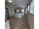 Bright kitchen with center island, wood-look flooring, and neutral color scheme at 134 Daytona Ave, Daytona Beach, FL 32117