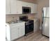Stainless steel appliances compliment the updated kitchen at 134 Daytona Ave, Daytona Beach, FL 32117
