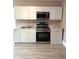 Modern kitchen with stainless steel appliances, white cabinetry, and durable countertops offering both style and functionality at 134 Daytona Ave, Daytona Beach, FL 32117