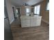 Bright kitchen with center island, wood-look flooring, and neutral color scheme at 134 Daytona Ave, Daytona Beach, FL 32117