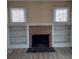 Close up view of the fireplace and built in shelving in the living room at 134 Daytona Ave, Daytona Beach, FL 32117