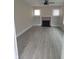 A well-lit living room with a fireplace, built-in shelving, and a ceiling fan for added comfort at 134 Daytona Ave, Daytona Beach, FL 32117