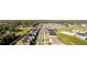 Wide aerial shot displays the community's layout and proximity to surrounding wooded areas at 1412 Mirabella Cir, Davenport, FL 33897