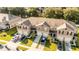 Aerial view highlights the townhome exteriors, showcasing garages and landscaped front yards at 1412 Mirabella Cir, Davenport, FL 33897