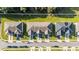Overhead view of the community showcases rooflines, landscaping, parking, and surrounding greenery at 1412 Mirabella Cir, Davenport, FL 33897