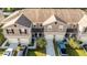 Aerial view of townhomes showcasing their neat layouts, landscaping, and convenient parking areas at 1412 Mirabella Cir, Davenport, FL 33897