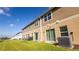 Exterior view of home featuring a well-maintained lawn and siding at 1412 Mirabella Cir, Davenport, FL 33897