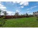 Brick fence that surrounds the spacious green lawn at 1447 Myrtle Oaks Trl, Oviedo, FL 32765
