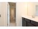Bathroom featuring a sleek dark vanity, white countertop, and open access to other rooms at 1447 Myrtle Oaks Trl, Oviedo, FL 32765