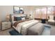 Comfortable bedroom with a plush bed, stylish decor, and a soft color palette, creating a relaxing retreat at 1447 Myrtle Oaks Trl, Oviedo, FL 32765