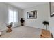 Cozy bedroom with a large window, neutral carpet, and neutral paint at 1447 Myrtle Oaks Trl, Oviedo, FL 32765