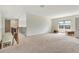 Large carpeted bonus room with great natural light from windows at 1447 Myrtle Oaks Trl, Oviedo, FL 32765