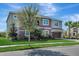 Beautiful two-story home with brick-paved driveway, lush lawn, and mature landscaping at 1447 Myrtle Oaks Trl, Oviedo, FL 32765