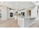 Spacious white kitchen with stainless steel appliances, double ovens, and granite countertops at 1447 Myrtle Oaks Trl, Oviedo, FL 32765