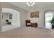 Neutral living room with comfortable seating and views to the entry and dining room at 1447 Myrtle Oaks Trl, Oviedo, FL 32765