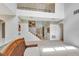 Spacious living room features an open floor plan and staircase to the second floor at 1447 Myrtle Oaks Trl, Oviedo, FL 32765