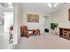 Neutral living room with a comfortable seating arrangement and ample natural light at 1447 Myrtle Oaks Trl, Oviedo, FL 32765