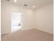 Spacious office with neutral tones, plush carpet, and recessed lighting offers a versatile workspace at 1447 Myrtle Oaks Trl, Oviedo, FL 32765